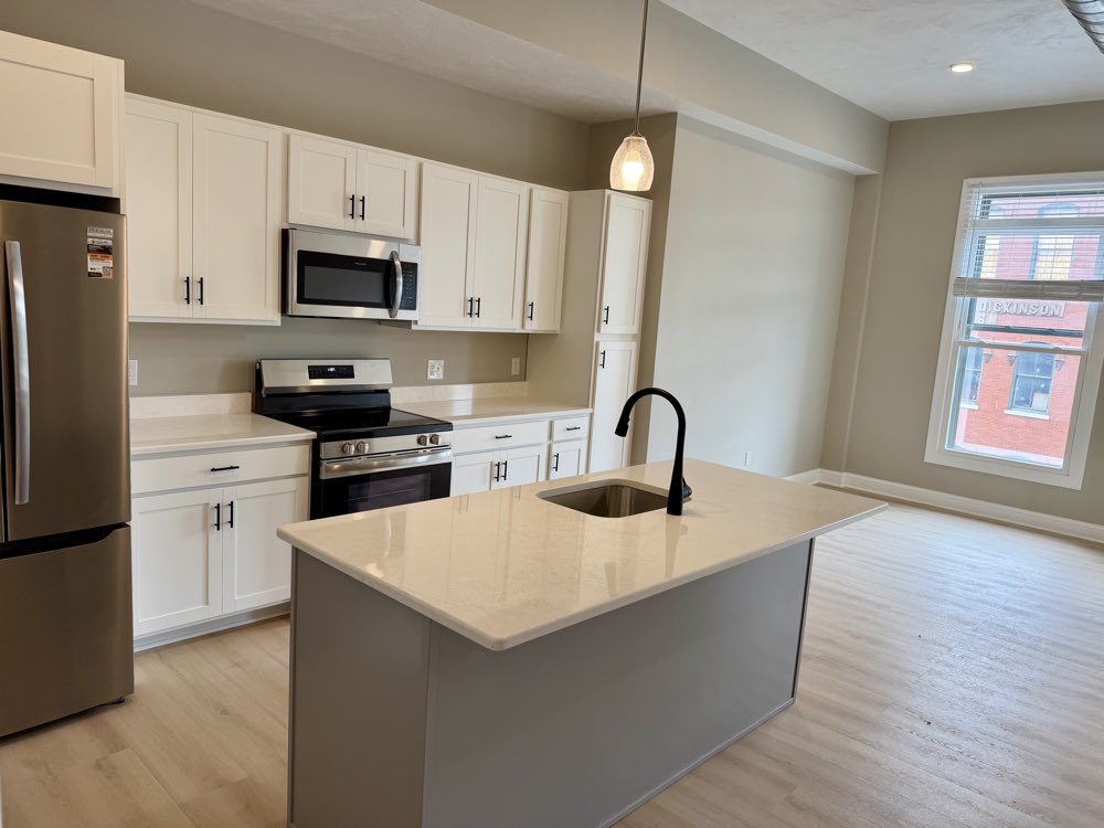 Apartment 6 — island kitchen with windows behind.