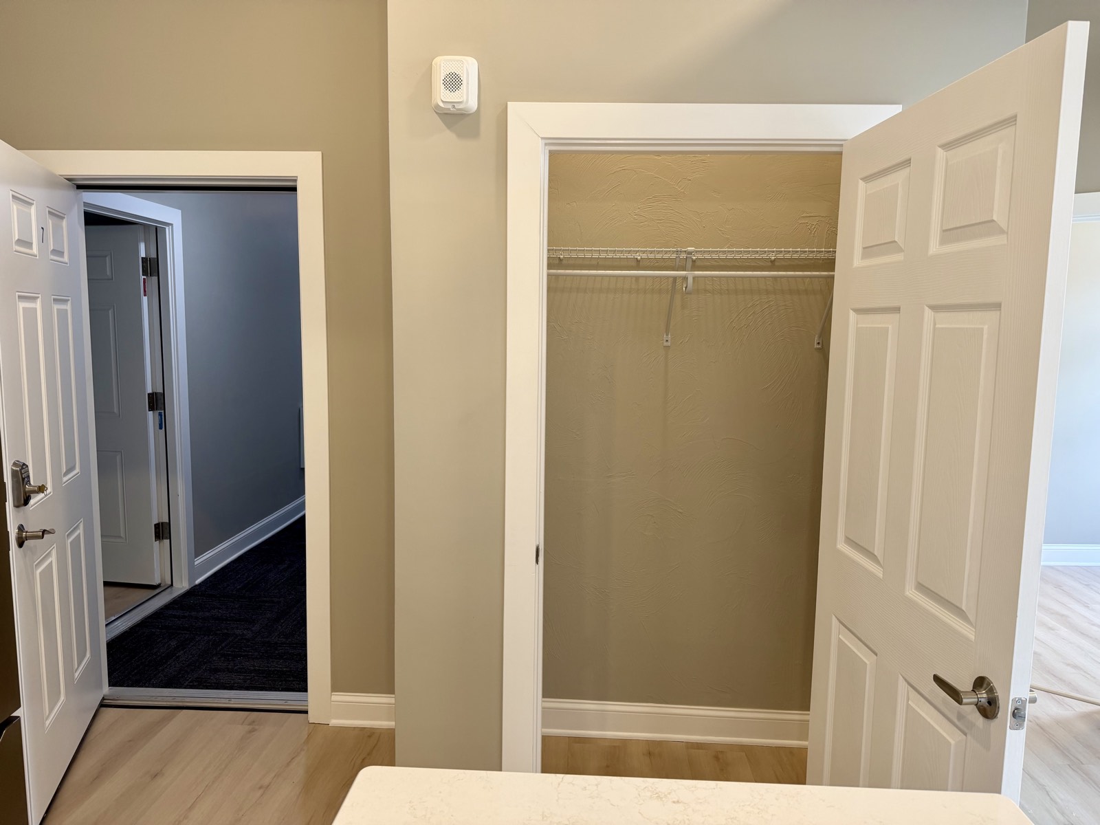Entry hall with closet and secure keypad door.